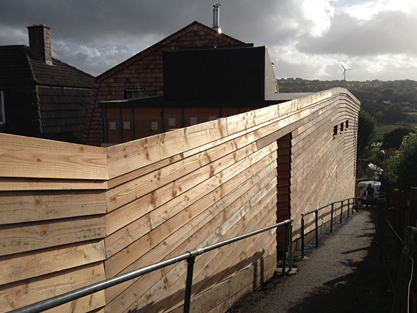 Wadebridge Responsive Home side elevation showing timber cladding flowing down with the path.